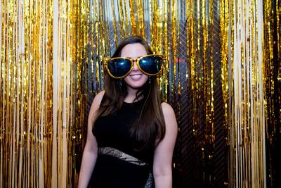 A girl with goofy glasses at a New Years Eve party in NYC.