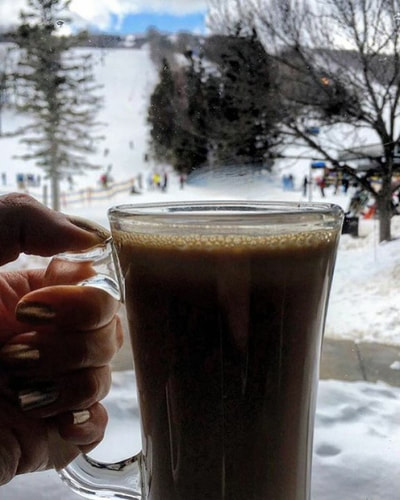 Drinking delicious hot cocoa on a ski trip to escape the city. 