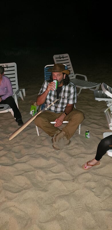 enjoying drinks around the bonfire on our private beach in the hamptons