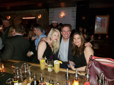 Friends at the bar at one of the hottest parties in NYC.