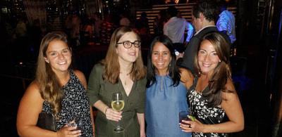 friends at an after work party for young NYC professionals
