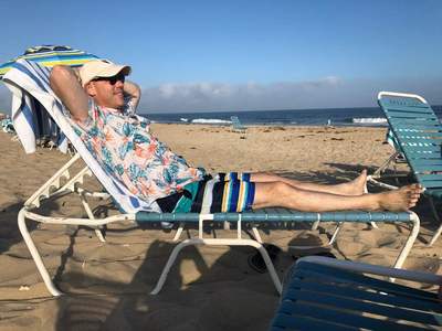 Jewish Professional from NYC reclines on our private beach at our oceanfront hotel in Montauk