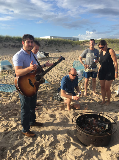 summer bonfire on our private beach at our hamptons summer share 