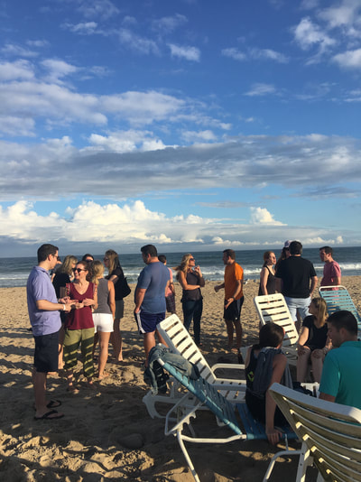 young single professionals from nyc mingling on our private beach while enjoying our summer share in montauk 