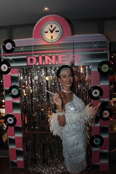 Woman dressed as a flapper at a trendy Halloween party in NYC.