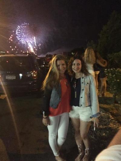 Two girls pose in front of the fireworks on our Fourth of July in the weekend in the Hamptons. 