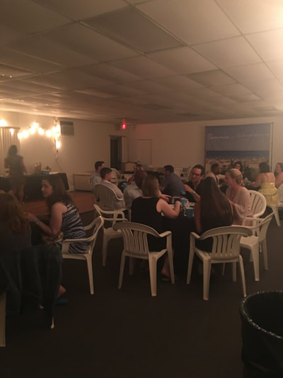 a group of young nyc professionals enjoying dinner at our summer share in montauk
