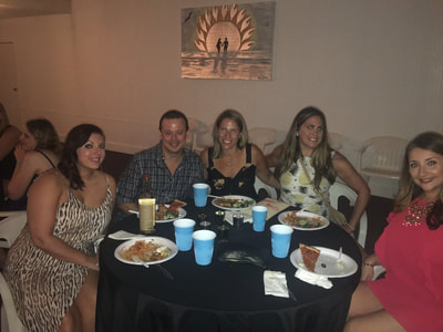 a group of friends enjoy dinner at our montauk summer share